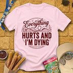 Everything Hurts [Badge] T-Shirt for Theme Park Fans (Light Pink)